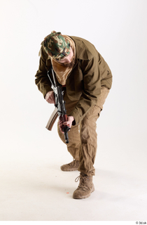 Andrew Elliott Pose with Gun aiming gun crouching standing whole…